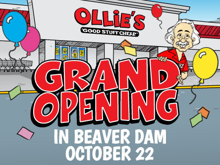 Image of Ollie in front of store that reads "Grand opening in Beaver Dam 10/22"