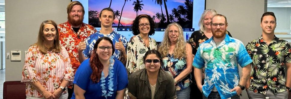 Photo of ollie's employees in hawaiin shirts