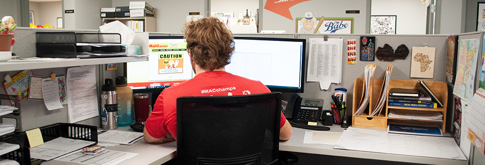 Photo of an ollie's employee working at a desk