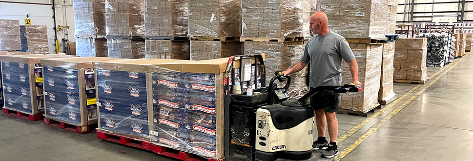 Photo of an ollie's employee working in the warehouse